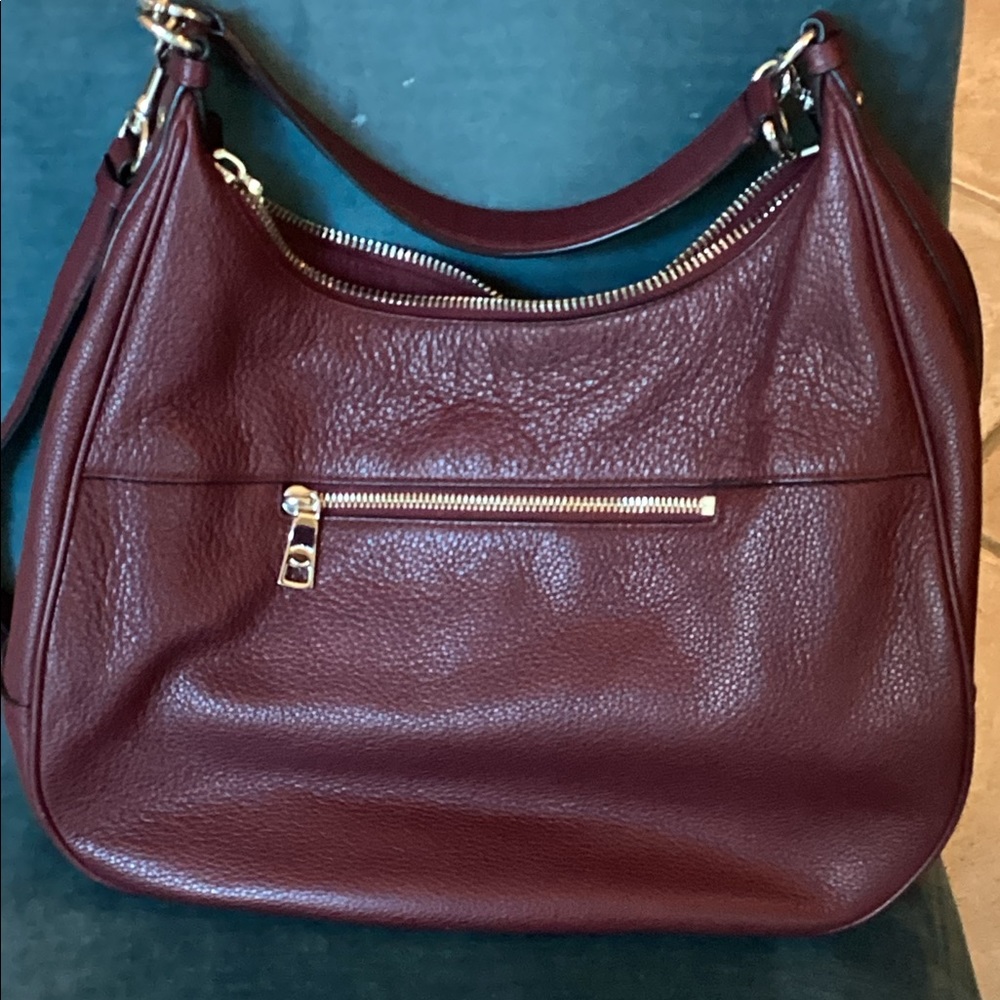 Coach curved eggplant shoulder bag, silver accents